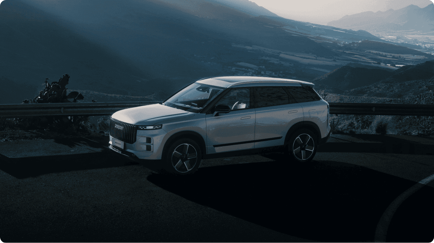 Silver JAECOO driving in mountain area